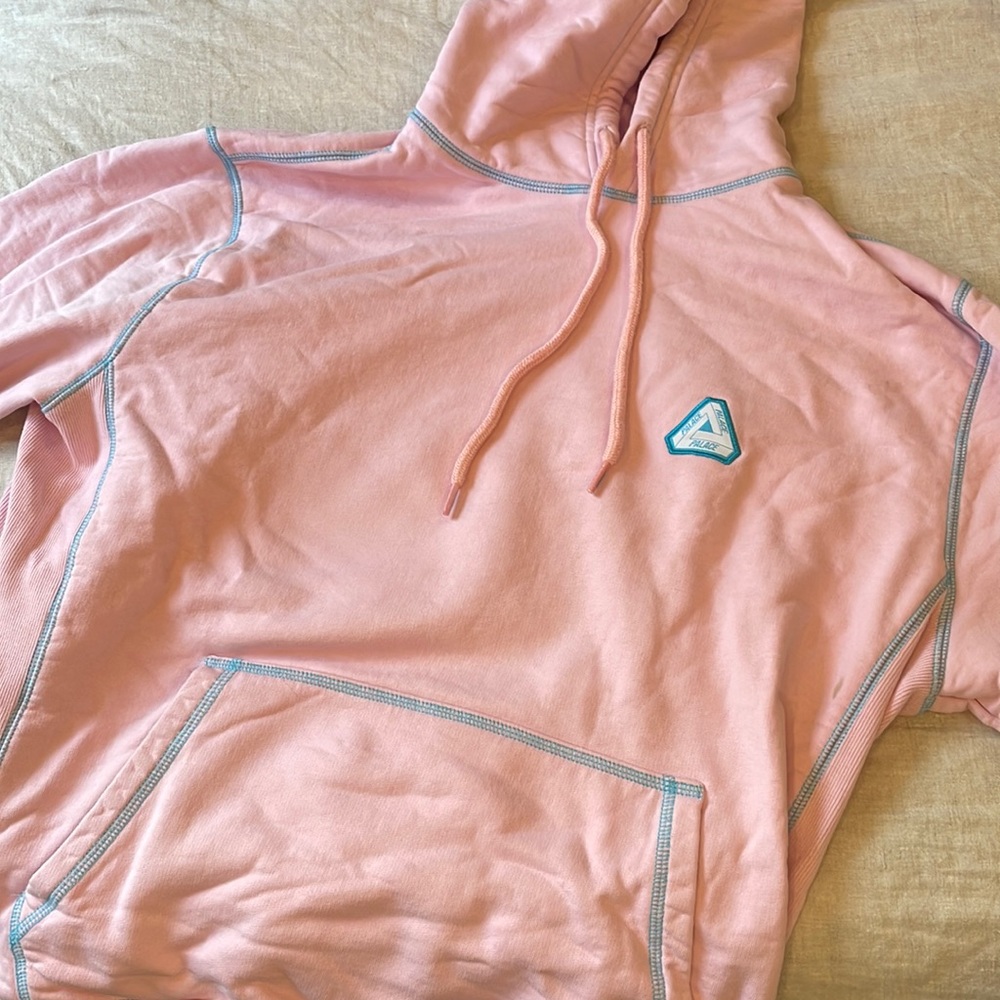 Pink Palace sweatshirt with blue stitching. Only worn twice.